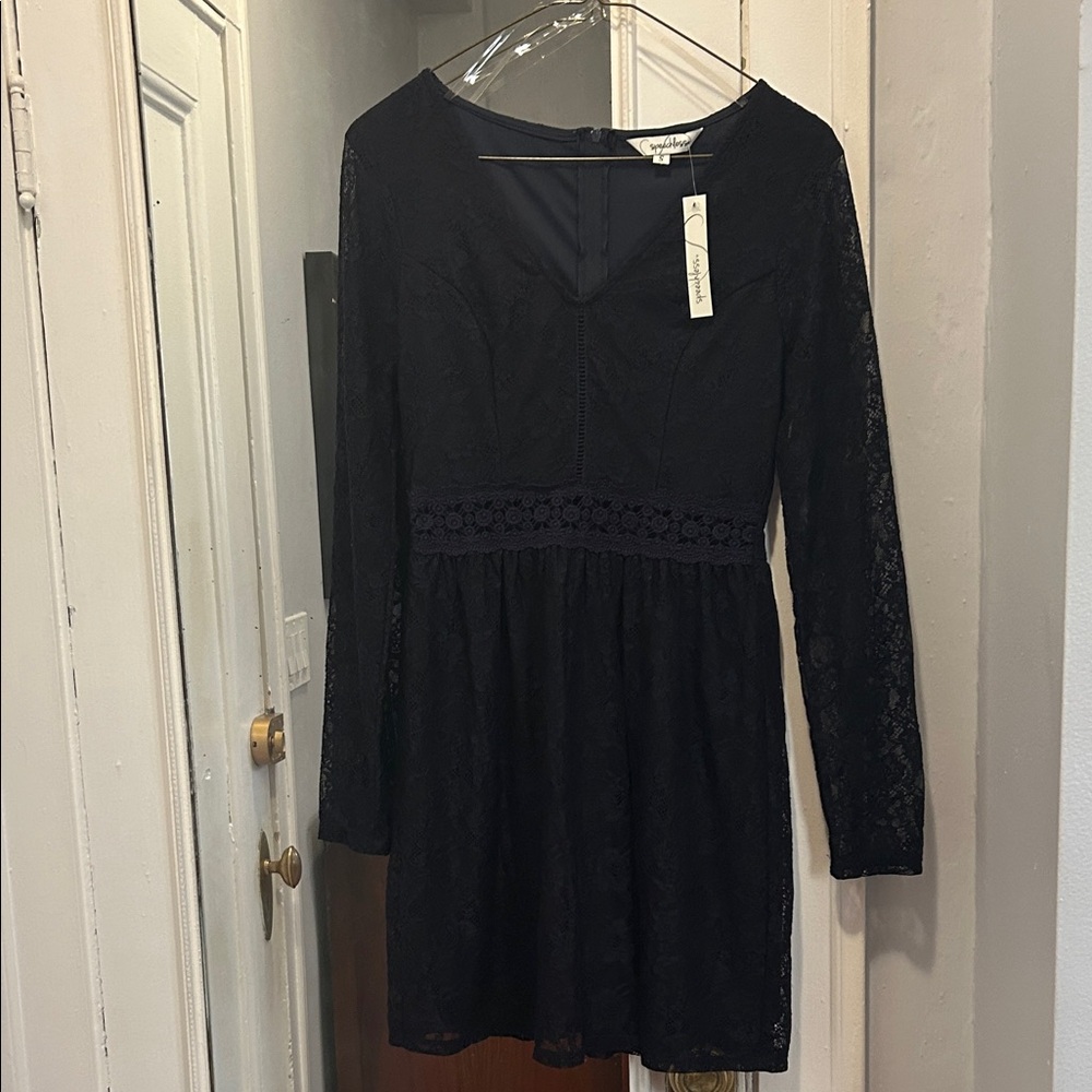 Long Sleeve Lace Dress.  Length is 32”. Never worn.  Color is navy